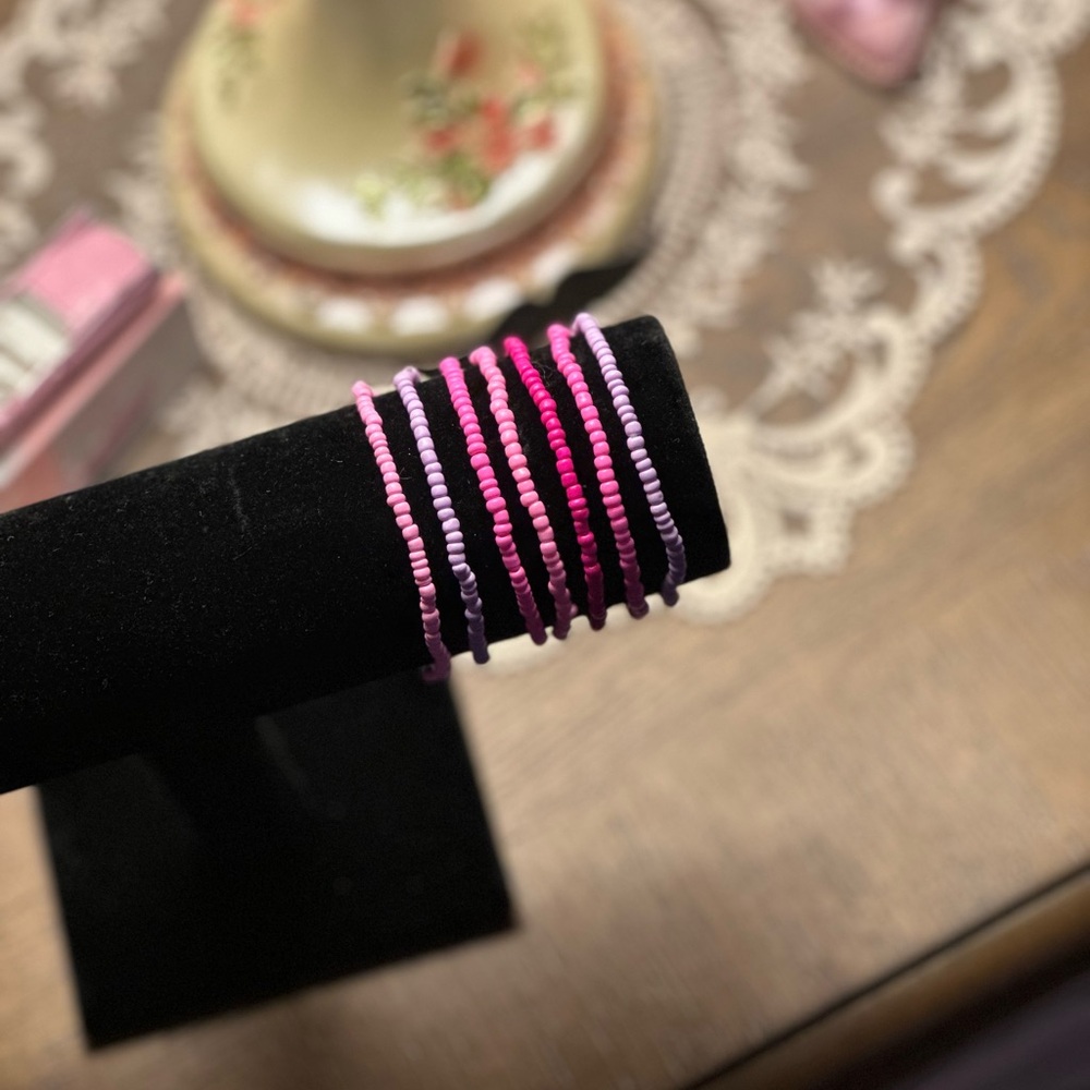 pink and purple beaded bracelet set
